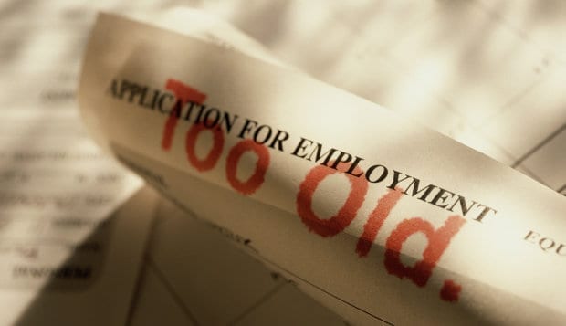 Image of a job application with words 'too old' written in red across it.