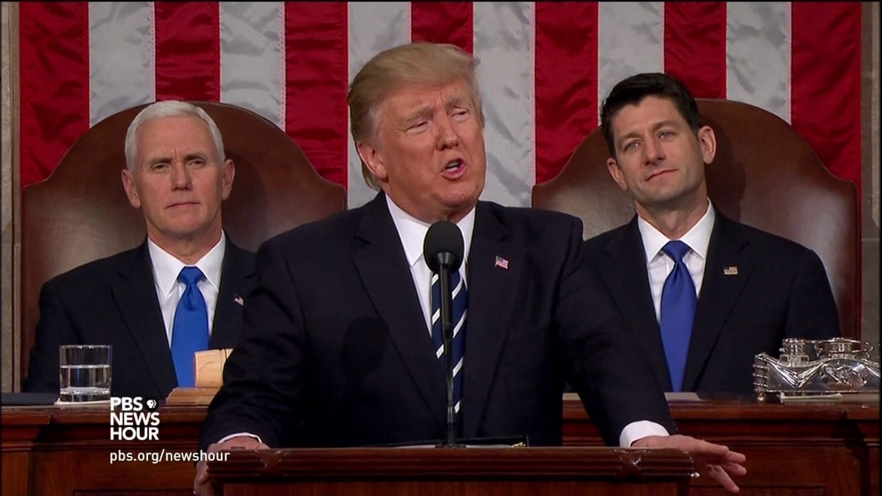 Flanked by Mike Pence and Paul Ryan, Donald Trump speaks before Congress in early 2017.