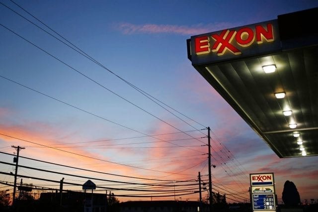 Exxon-Mobile gas station with sunset in the background.