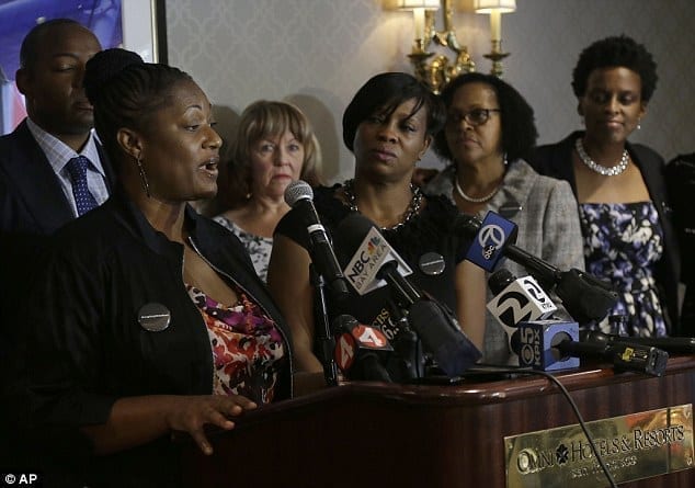 Image of Brown and Tichaona and a news conference