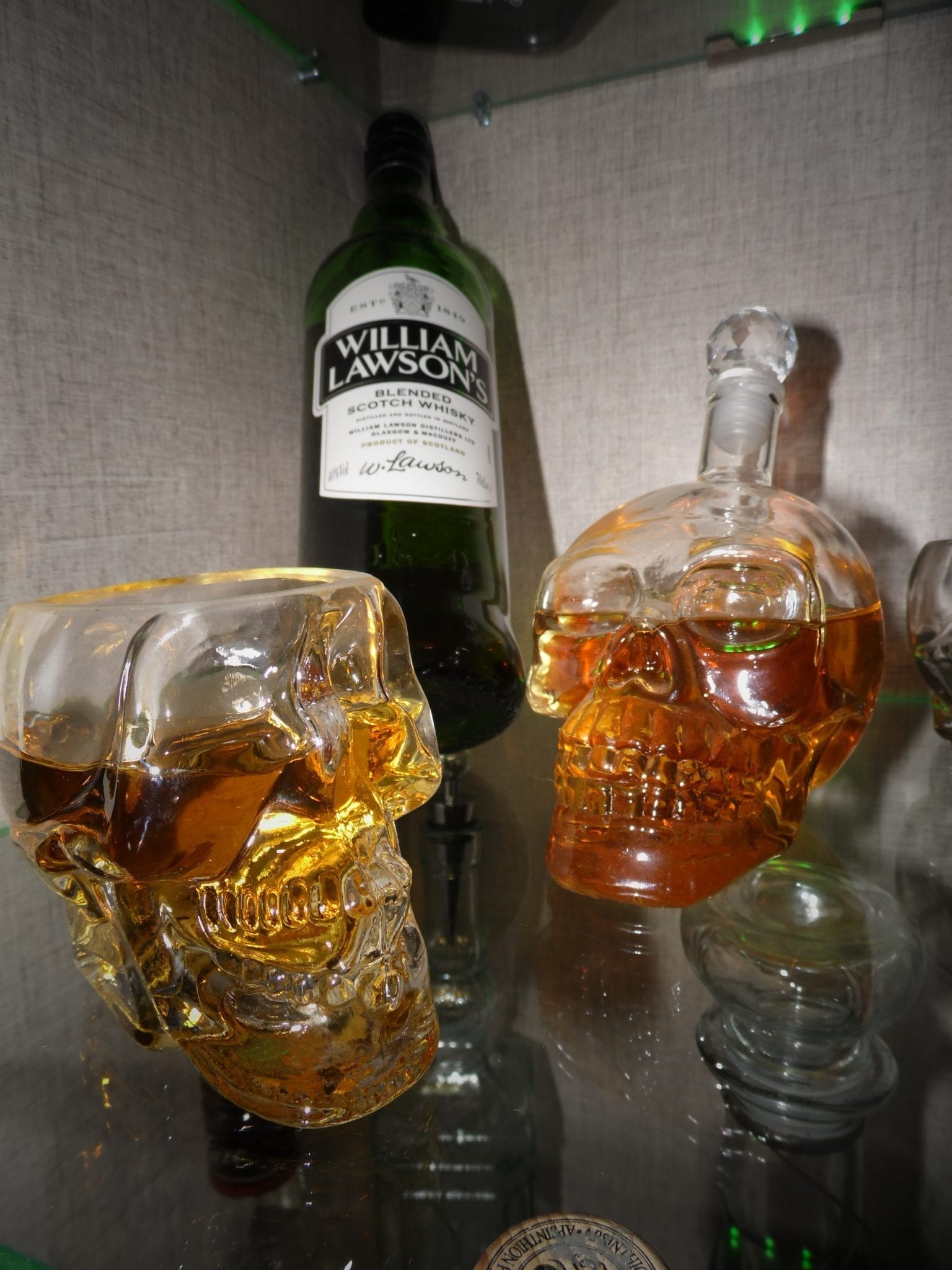 Scotch whiskey in skull-shaped glasses; image via Pxhere, CC0.