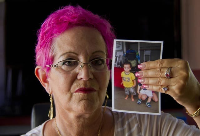Maryann Rooney holding a picture of her deceased grandson, Zion McKeown