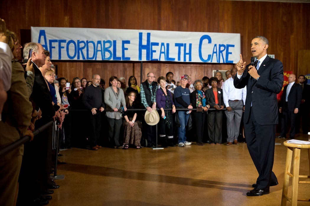 Then-President Barack Obama delivers remarks at an Affordable Care Act event at Temple Emanu-El in Dallas, Texas, Nov. 6, 2013. Official White House Photo by Pete Souza, Public domain.