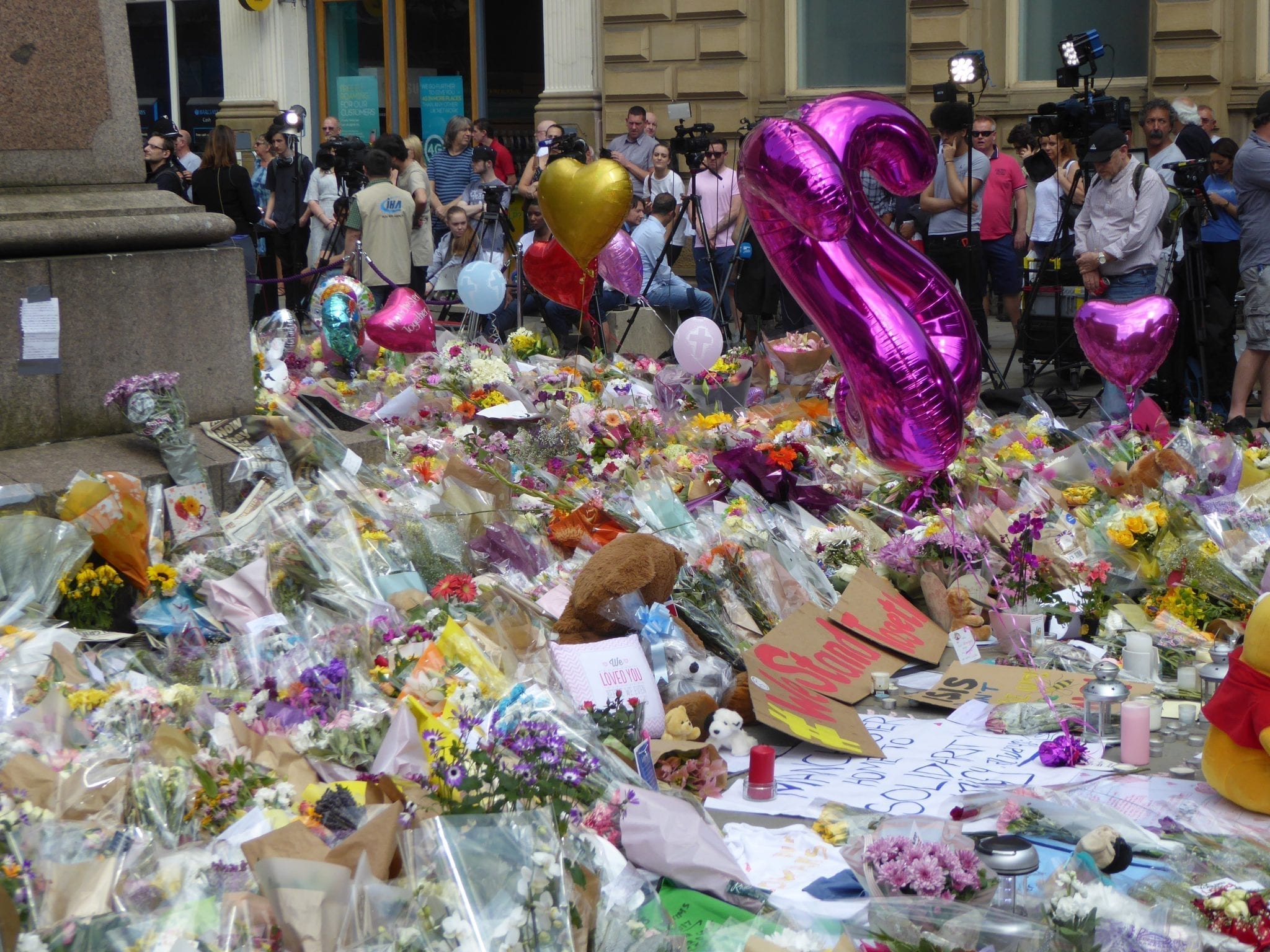 Tributes and memorials at St Ann's Square,Manchester, England, following the Manchester Arena bombing, May 2017. By Ardfern (Own work), CC BY-SA 4.0, via Wikimedia Commons, no changes.