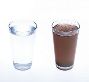 Glasses of clean and dirty water; image by Aqua Mechanical, via Flickr, CC BY 2.0, no changes.