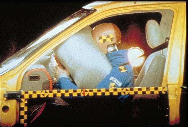 Airbag deploys for crash test dummy.