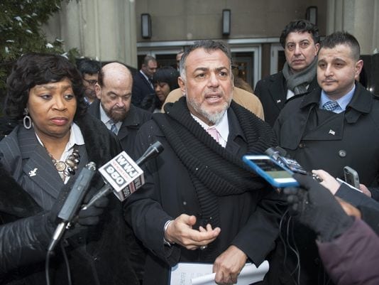 Attorney Nabih Ayad answers questions outside a Detroit courthouse