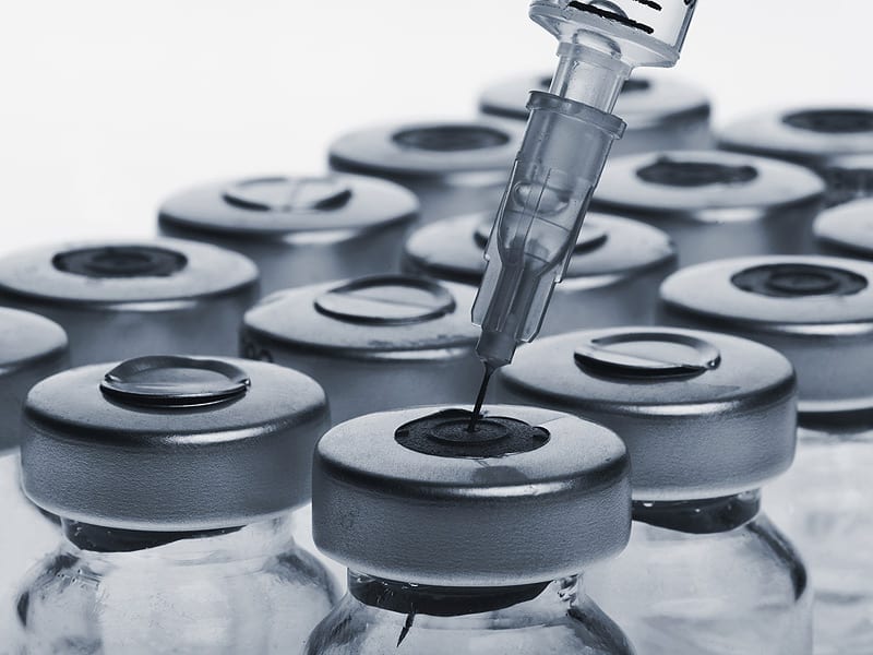 Bottles of injectables with syringe; image courtesy of www.medscape.com.