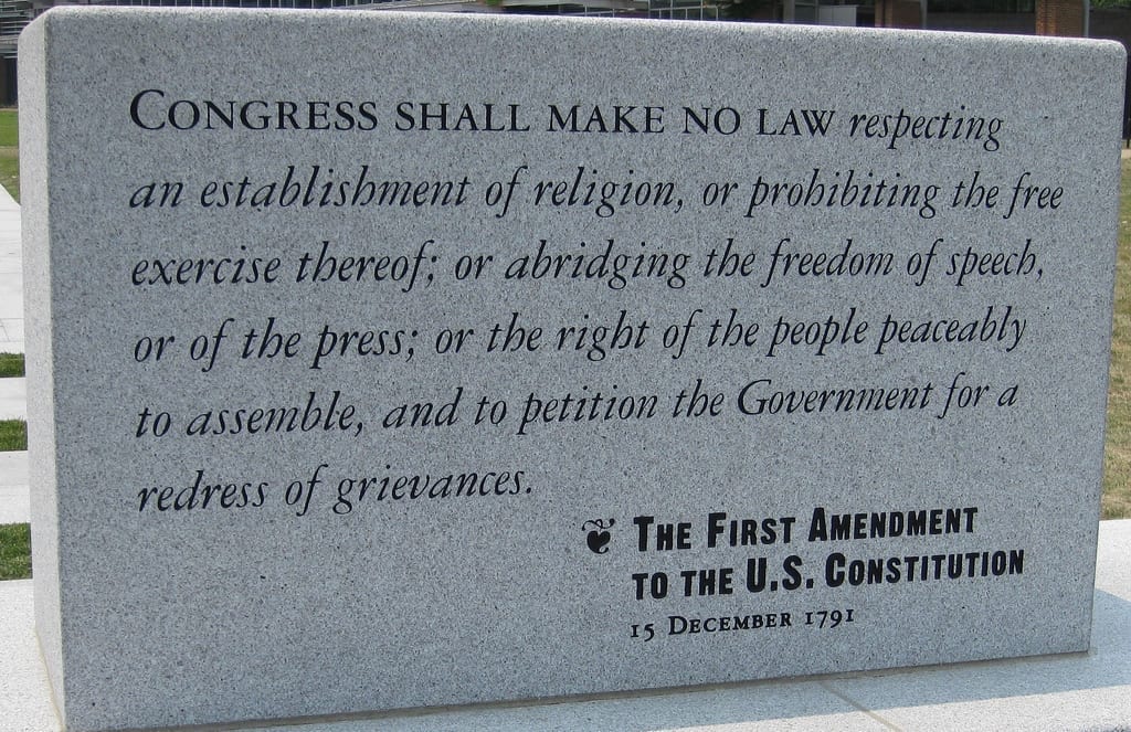 A stone tablet bearing the words of the First Amendment.