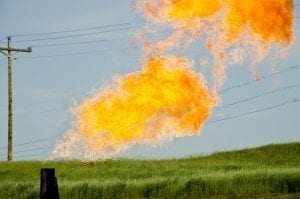 Natural gas flares from a flare-head at the Orvis State well on the Evanson family farm in McKenzie County, North Dakota.