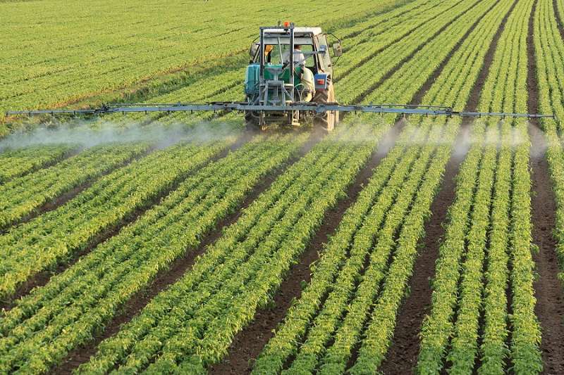 Tractor spraying pesticide