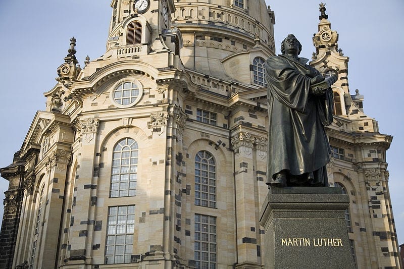 A statue of Martin Luther, who sparked the Protestant Reformation, stands in front of the rebuilt Frauenkirche in Dresden, Germany.