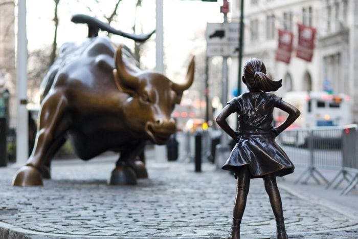 Image of Fearless Girl Challenging Wall Street's Charging Bull
