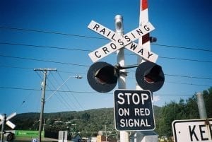 A railroad crossing. The sign says "Railroad Crossing" and "Stop on Red Signal."