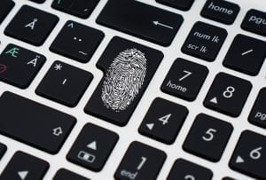 A computer keyboard. One of the buttons is marked with a fingerprint.