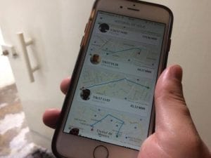 The Uber app open on a user's smartphone. Image by Ryan J. Farrick.