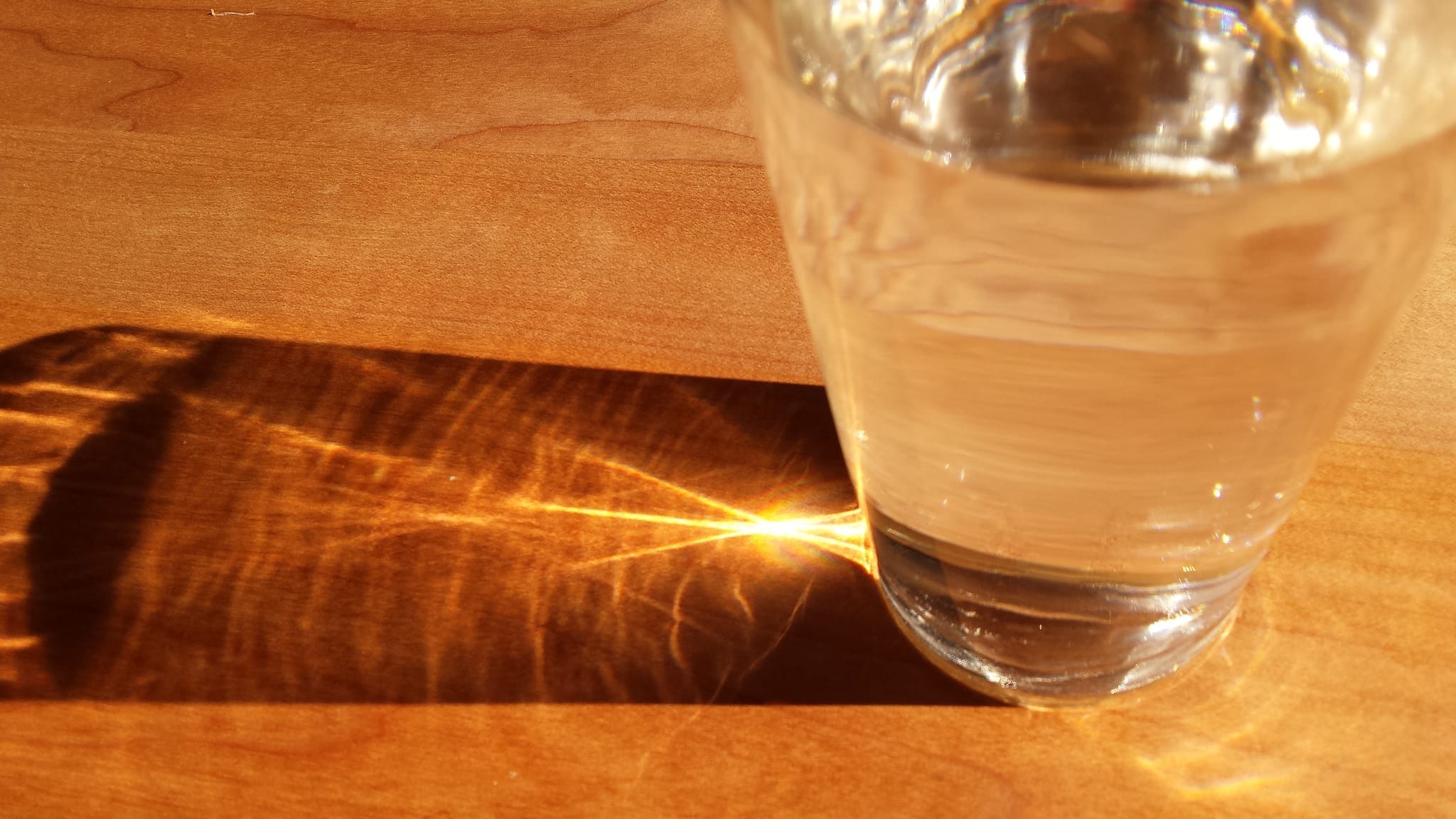 Example of clean water; image by Wonderlane, lense effect, light through a glass of water, via Flickr, CC BY 2.0.