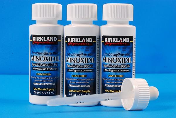 Bottles of Minoxidil; image courtesy www.huskybeard.com.