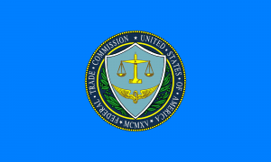 Flag of the United States Federal Trade Commission; image by United States Federal Trade Commission (FTC), Public domain, via Wikimedia Commons. Deceptive debt collectors banned.