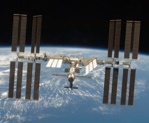 The International Space Station, backed by the Planet Earth.