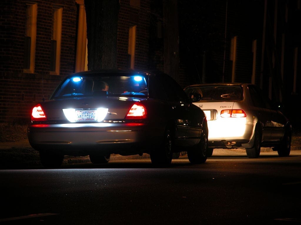 Night-time traffic stop on Gregson St. in Durham, North Carolina; image by Ildar Sagdejev (Specious), CC BY-SA 4.0, via Wikimedia Commons, no changes.