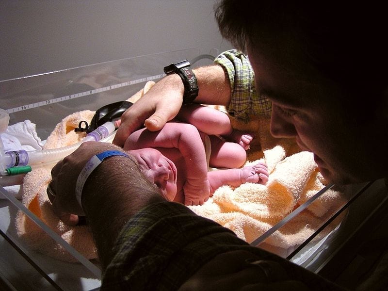 Image of a newborn on a warming tray
