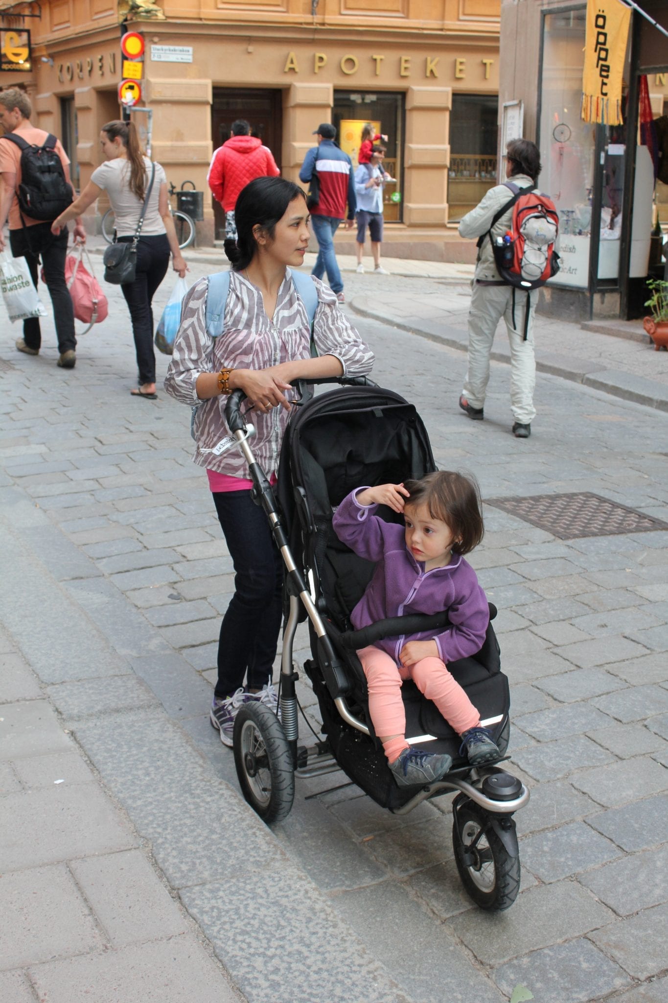 image of a child being pushed in a stroller