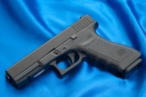 An early "third generation" Glock 17 (full-size pistol chambered for 9x19mm Parabellum), identified by the addition of thumb rests, an accessory rail, finger grooves on the front strap of the pistol grip and a single cross pin above the trigger. Image courtesy of Ken Lunde (own work), http://lundestudio.com, CC BY-SA 3.0, via Wikimedia Commons, no changes.
