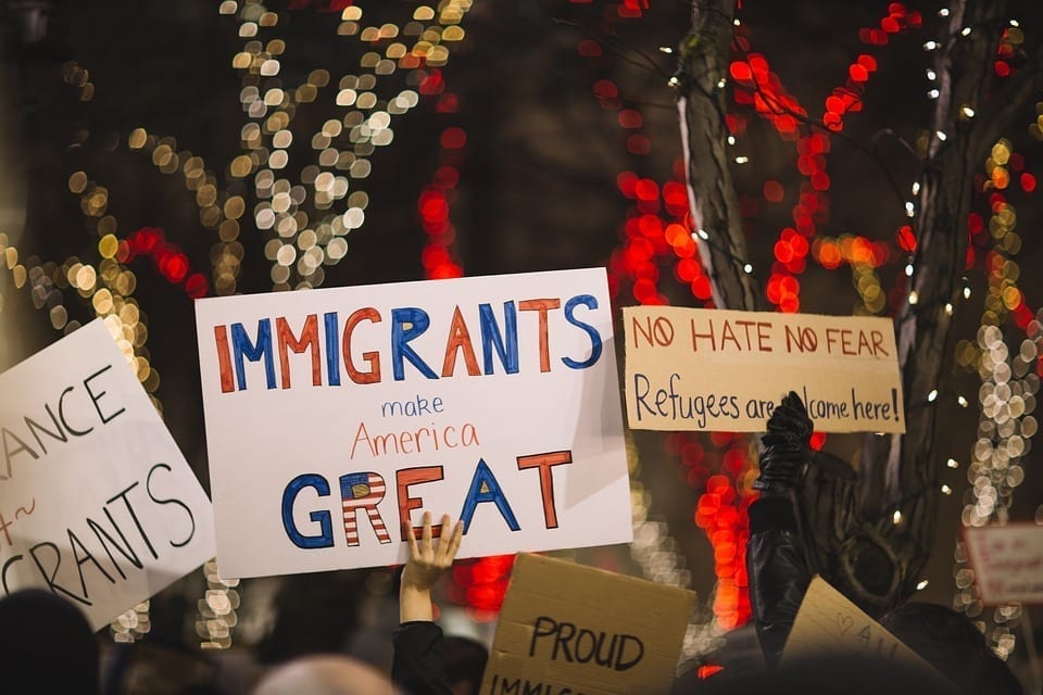 Image of posters at an immigration rally