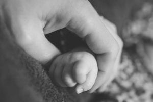 Mother and baby hands; image by StockSnap, via Pixabay, CC0.
