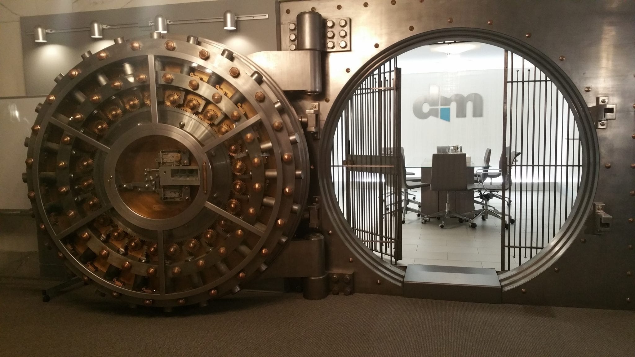 Open vault with conference table and chairs inside; image via Pxhere, CC0.