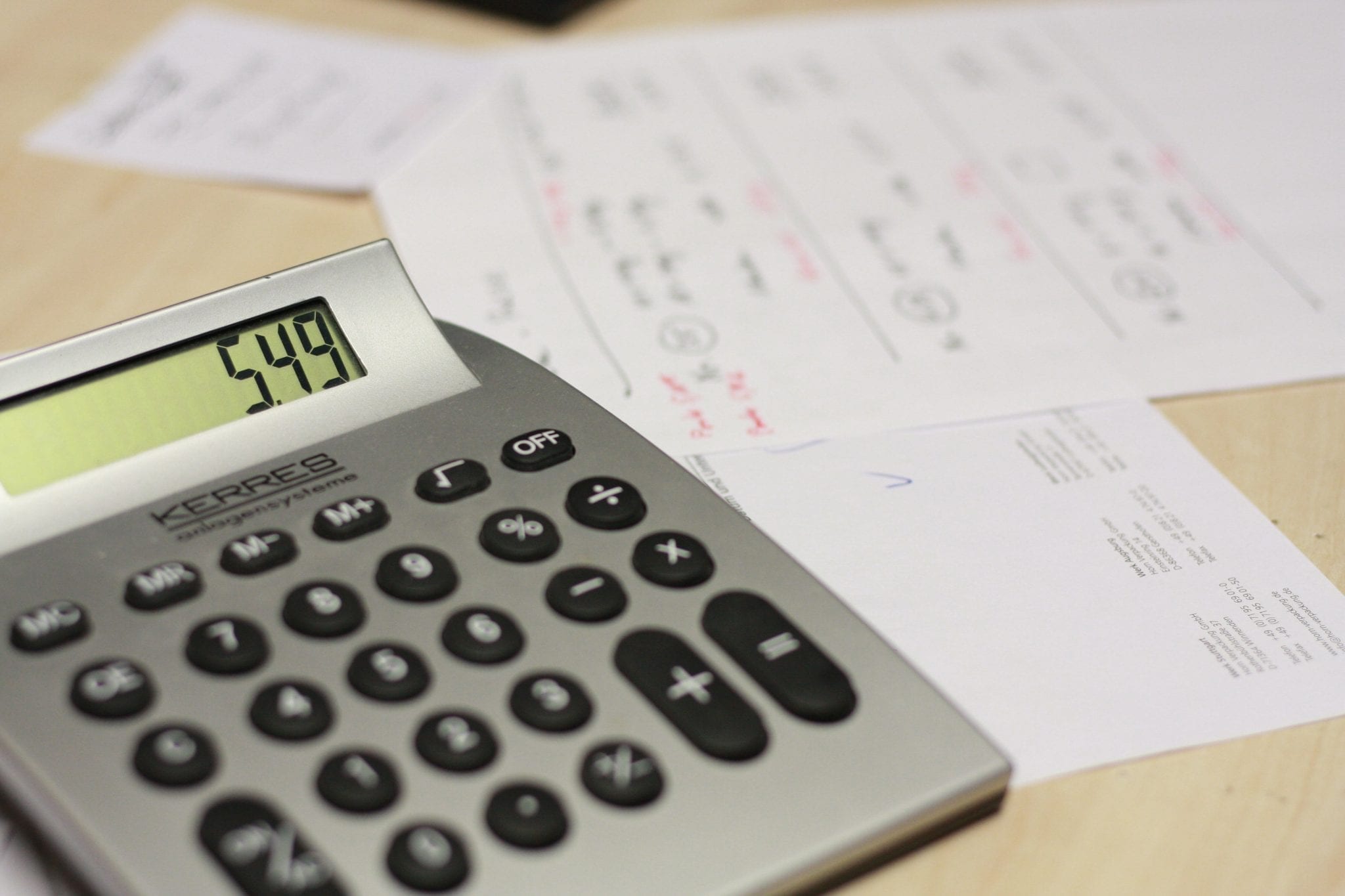 Calculator and paperwork; image via Pxhere, CC0.