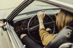 Image of a female driver in her car