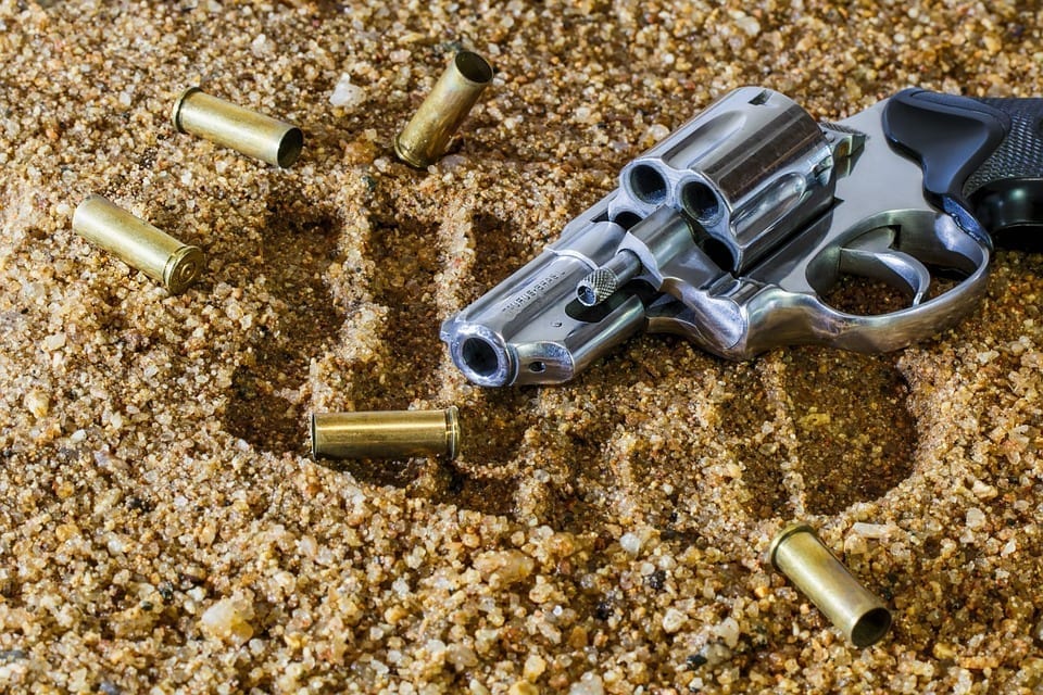 Image of a Gun and Bullet Casings