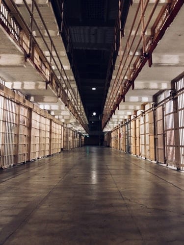 Image of a hallway of jail cells
