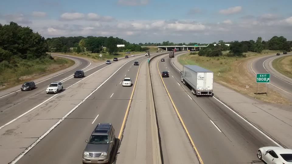 Light daytime traffic on a major American freeway.