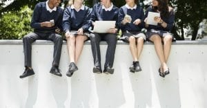 Students doing homework in the park; royalty free image on RawPixel.