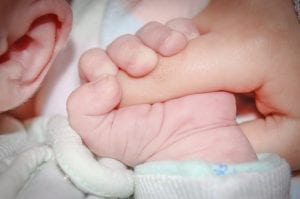 Image of a Baby Holding a Finger