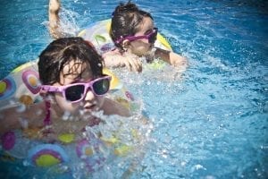 Image of Children Swimming in a Swimming Pool