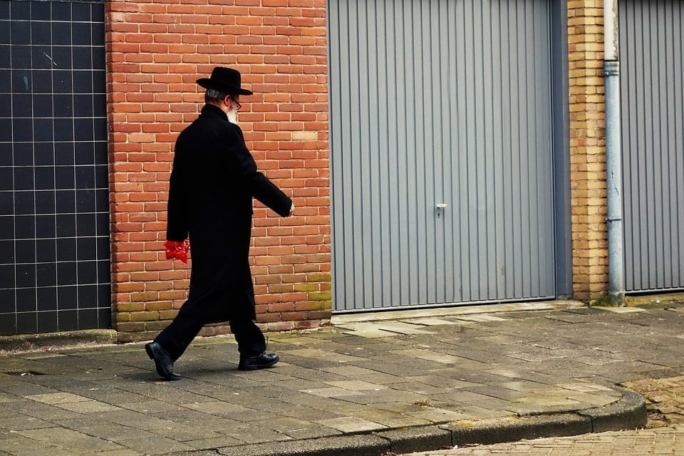 Image of an Orthodox Jew Walking Down a Sidewalk