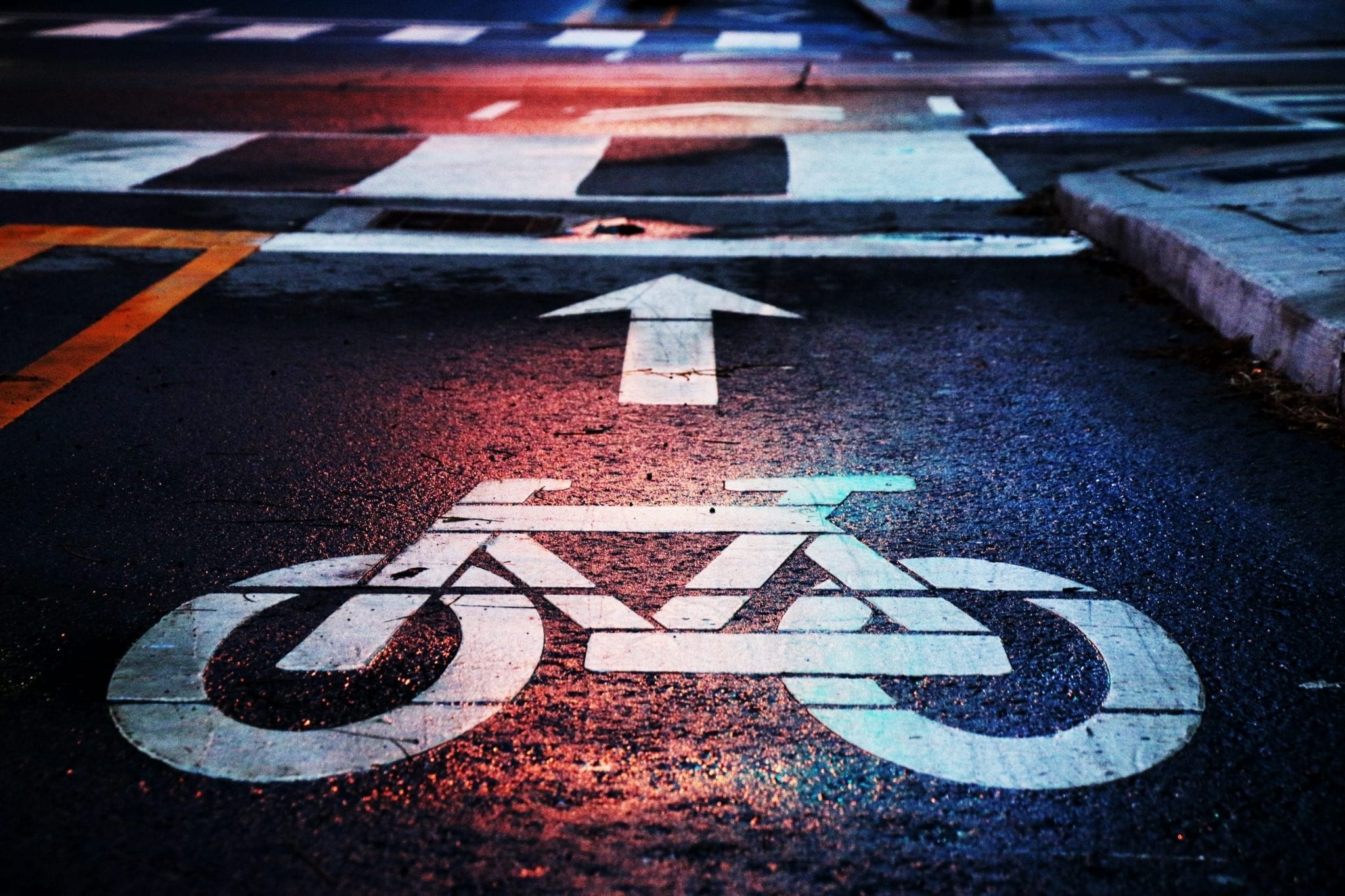 Bicycle lane marker; image by Andrew Gook, via Unsplash.com.