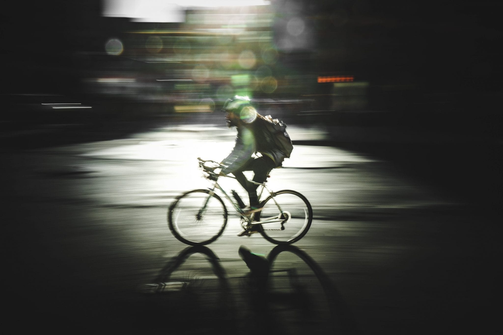 Man on bicycle; image by S (@projct33), via Unsplash.com.