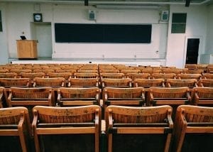 Empty classroom with chairs facing chalkboard; image by Pixabay.com, via Pexels.com, CC0.