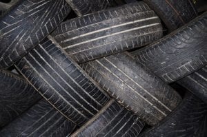 Stack of old tires arranged in a criss-cross pattern; image by George Hodan, PublicDomainPictures.net, CC0.