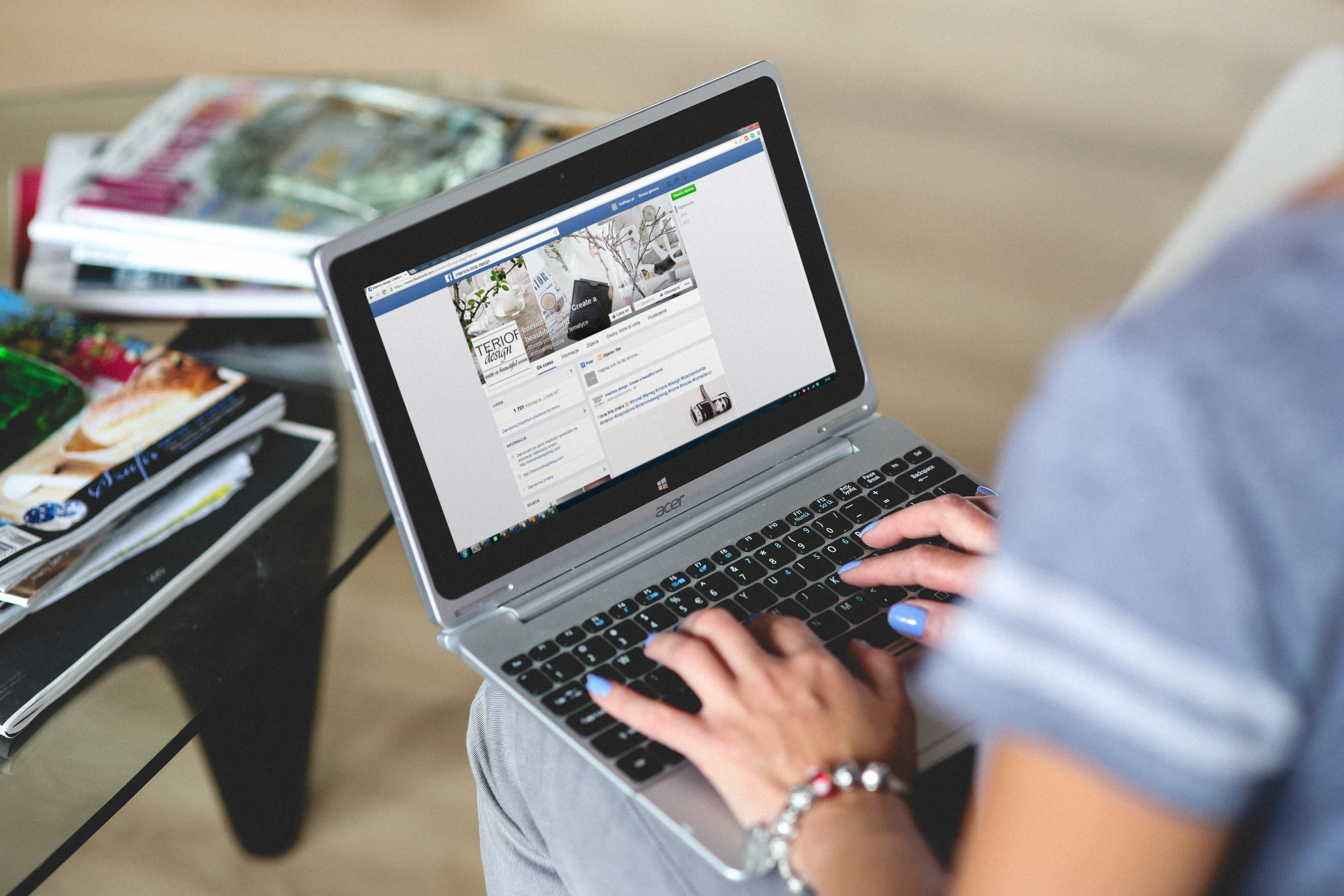 Woman viewing Facebook on a laptop computer; image via Pexels.com.