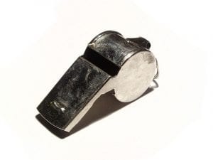 A metal pea whistle