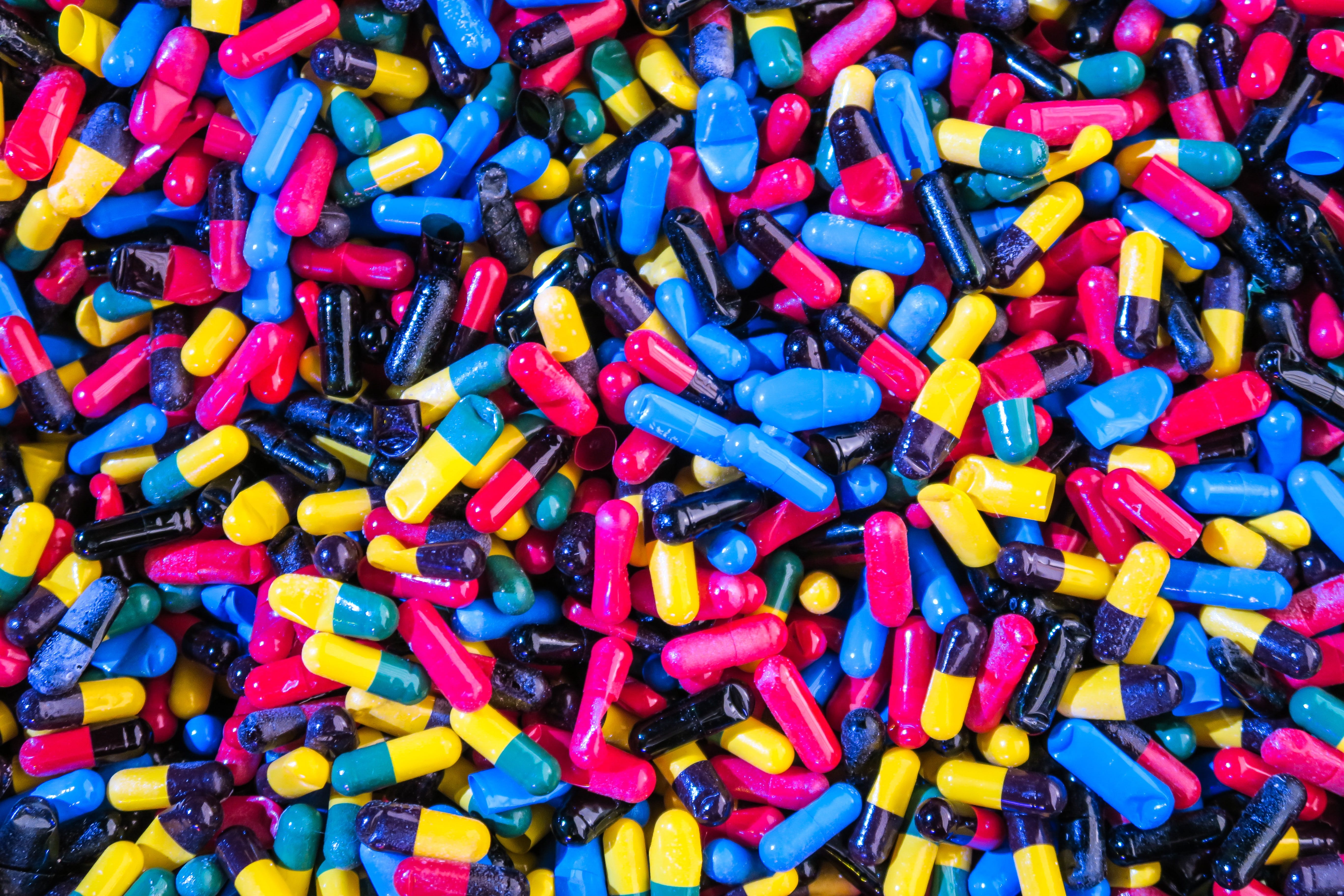 Assorted-color pills; image by Joshua Coleman, via Unsplash.com.