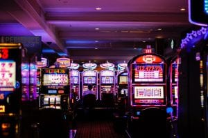 Banks of slot machines; image by Benoit Dare, via Unsplash.com.