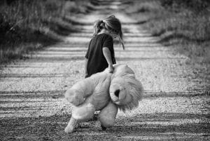 Sad girl with teddy bear