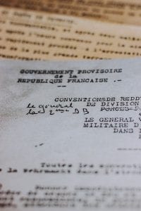 Legal document written in French with edit marks; image by Mat Reding, via unsplash.com.